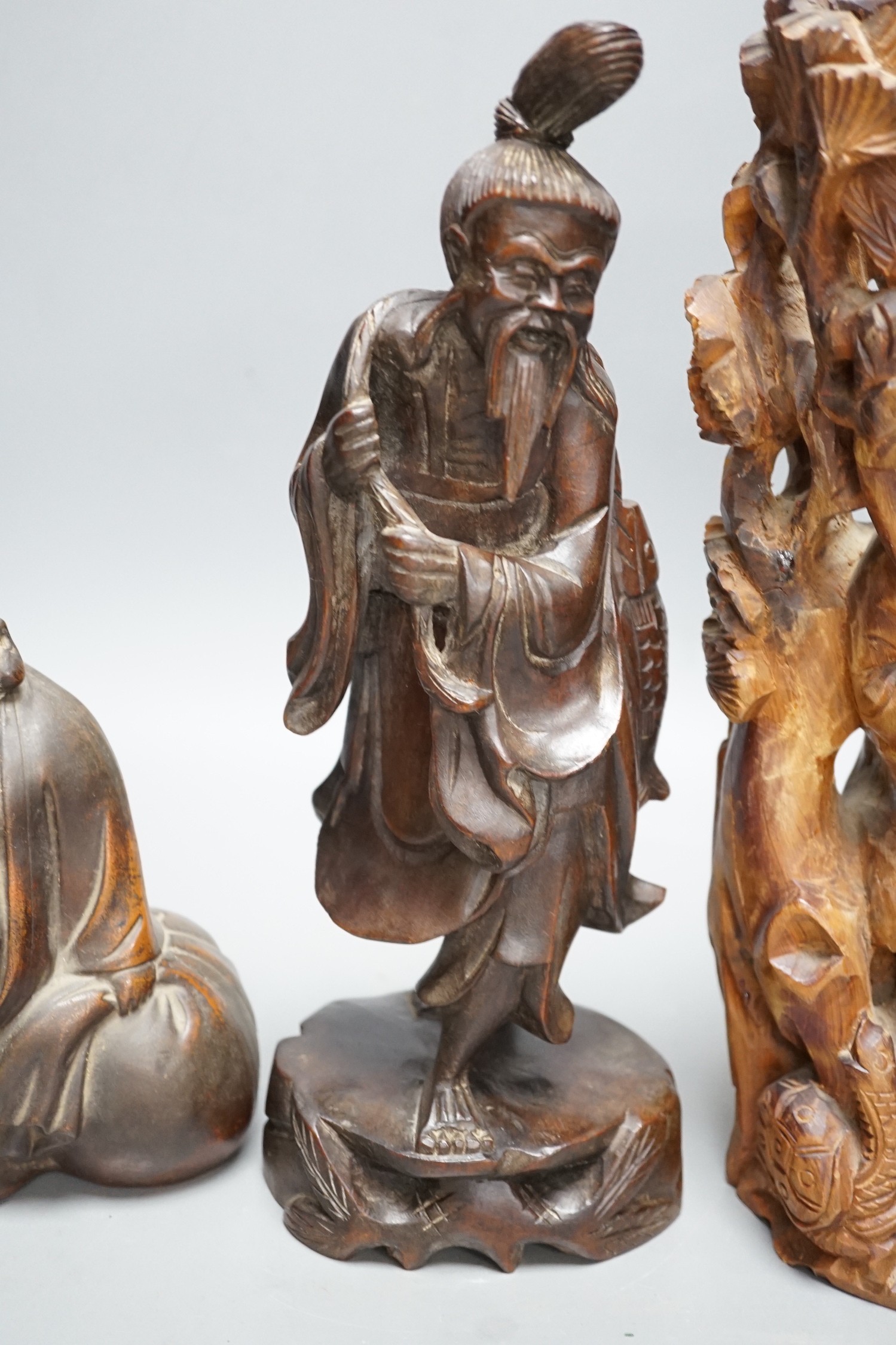 Two Chinese wooden figures and a Bizen pottery figure